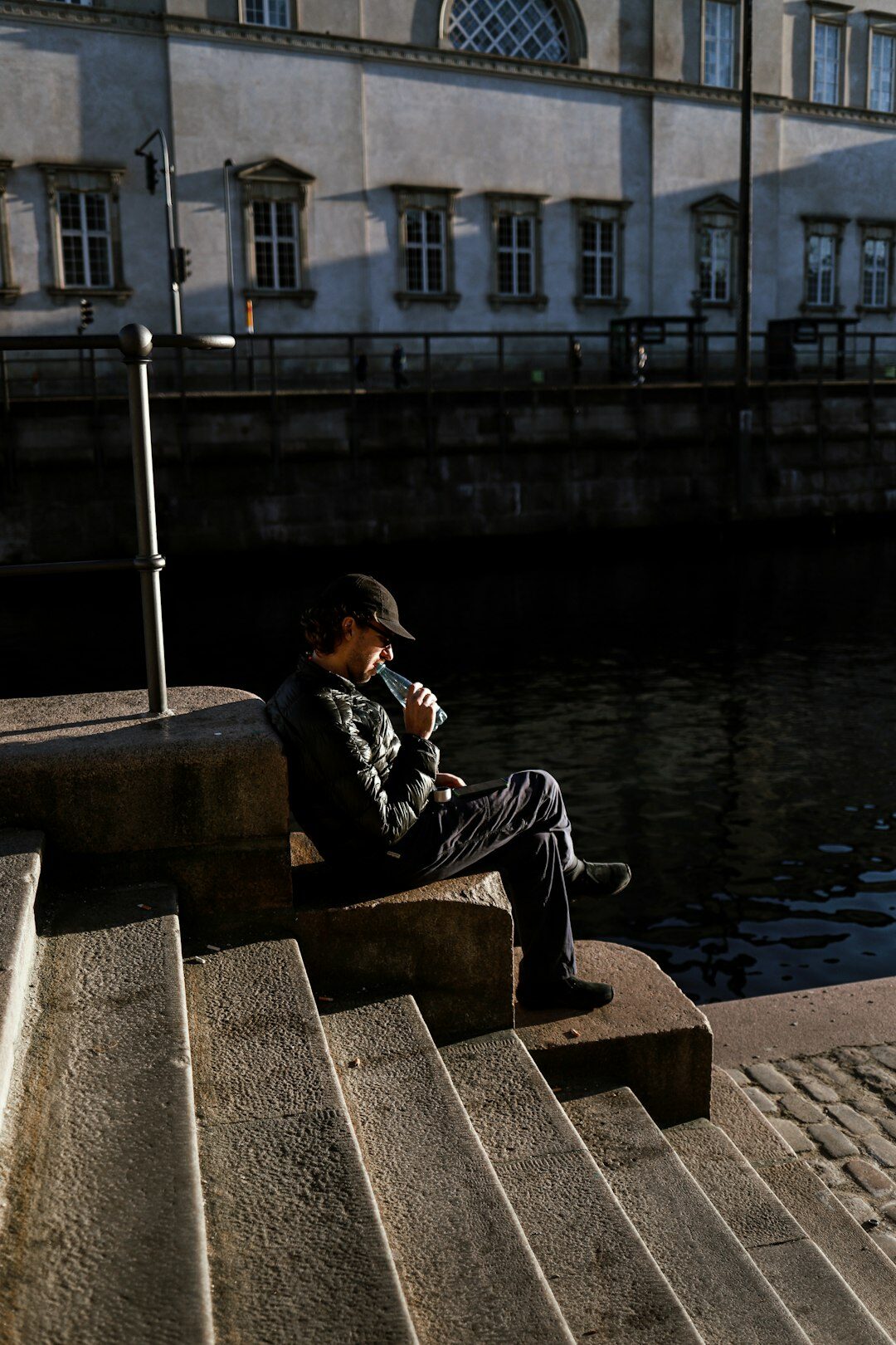 Elderly Danish fisherman mending nets in a coastal village